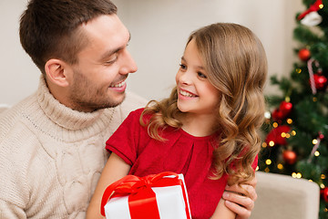 Image showing smiling father and daughter looking at each other