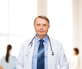 Image showing smiling doctor or professor with stethoscope