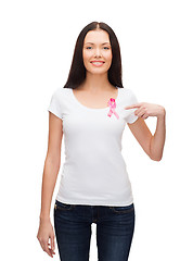 Image showing smiling woman with pink cancer awareness ribbon