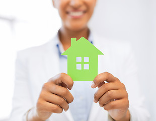 Image showing woman hands holding green house