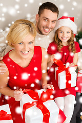 Image showing happy family opening gift boxes