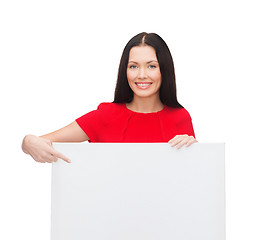 Image showing smiling young woman with blank white board