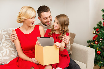 Image showing smiling family with tablet pc