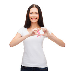 Image showing smiling woman with pink cancer awareness ribbon