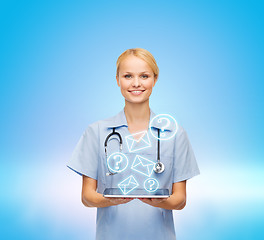 Image showing smiling female doctor or nurse with tablet pc