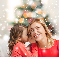 Image showing mother and daughter whispering gossip