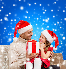 Image showing smiling father giving daughter gift box