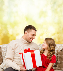 Image showing smiling father and daughter looking at each other