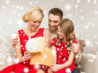 Image showing happy family opening gift box