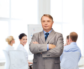 Image showing serious businessman or teacher in suit