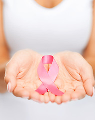 Image showing hands holding pink breast cancer awareness ribbon