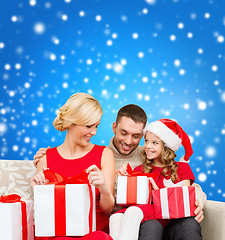 Image showing happy family opening gift boxes