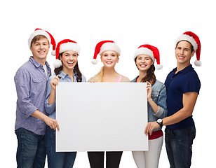 Image showing group of smiling students with white blank board