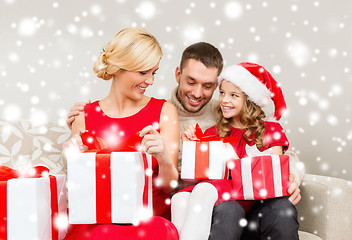 Image showing happy family opening gift boxes