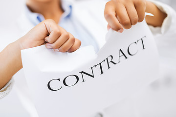 Image showing woman hands tearing contract paper