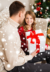 Image showing smiling father and daughter looking at each other