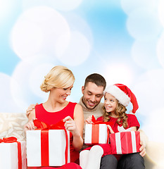 Image showing happy family opening gift boxes