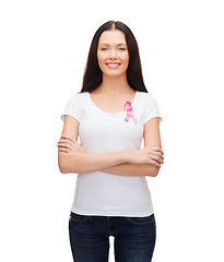 Image showing smiling woman with pink cancer awareness ribbon