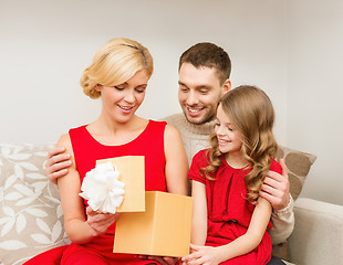 Image showing happy family opening gift box