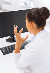 Image showing stressed businesswoman with computer