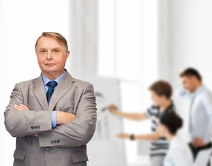 Image showing serious businessman or teacher in suit