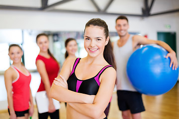 Image showing woman standing in front of the group in gym