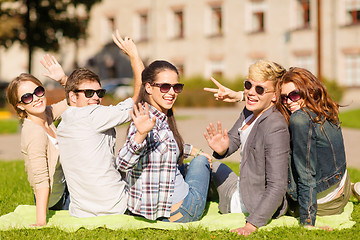 Image showing group of students or teenagers waving hands