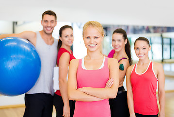 Image showing woman standing in front of the group in gym