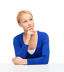 Image showing serious young woman making decisions