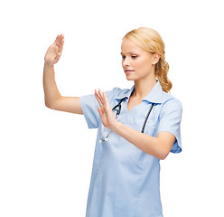 Image showing doctor or nurse working with virtual screen