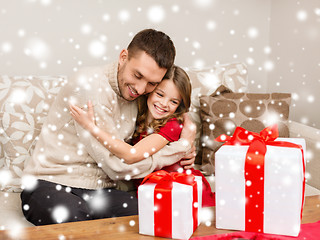 Image showing smiling father and daughter hugging