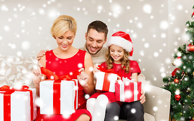 Image showing happy family opening gift boxes