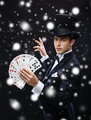 Image showing magician showing trick with playing cards