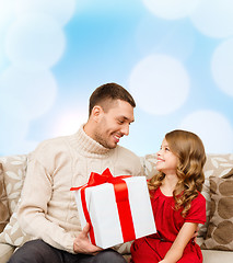 Image showing smiling father and daughter looking at each other