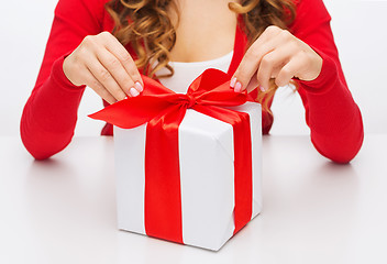 Image showing woman hands opening gift boxes