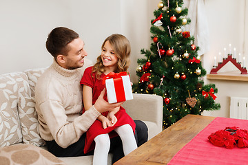 Image showing smiling father and daughter looking at each other