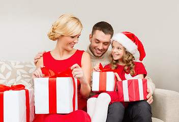 Image showing happy family opening gift boxes