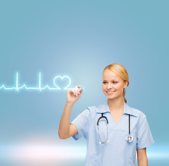 Image showing smiling doctor or nurse drawing cardiogram