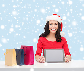 Image showing woman in santa helper hat with tablet pc