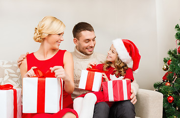 Image showing happy family opening gift boxes