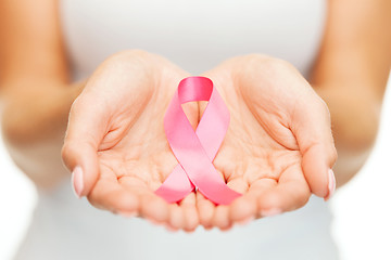 Image showing hands holding pink breast cancer awareness ribbon