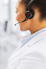 Image showing female helpline operator with headphones