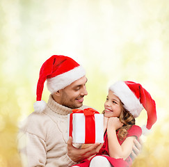 Image showing smiling father giving daughter gift box