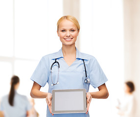 Image showing smiling female doctor or nurse with tablet pc