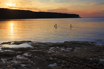 Image showing Paddle boarding on Botany Bay at sunrise