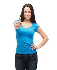 Image showing smiling girl in blue t-shirt showing thumbs up