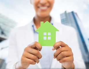 Image showing woman hands holding green house