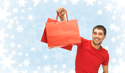 Image showing smiling man with shopping bags