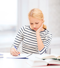 Image showing concentrated woman studying in college