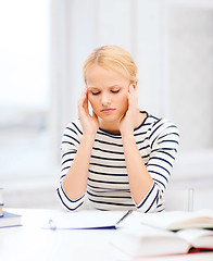 Image showing concentrated woman studying in college